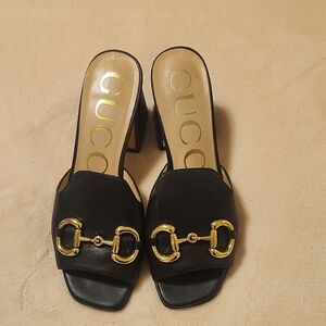 Gucci Black Mules with Gold Detailing